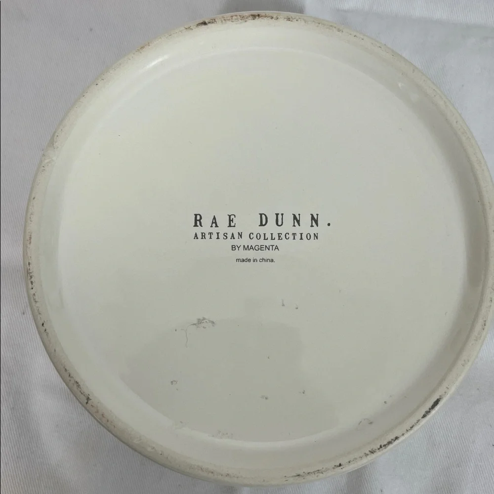NWOT Rae Dunn white ceramic dog bowl 6” wide, 3” high. Paw print front, Devour